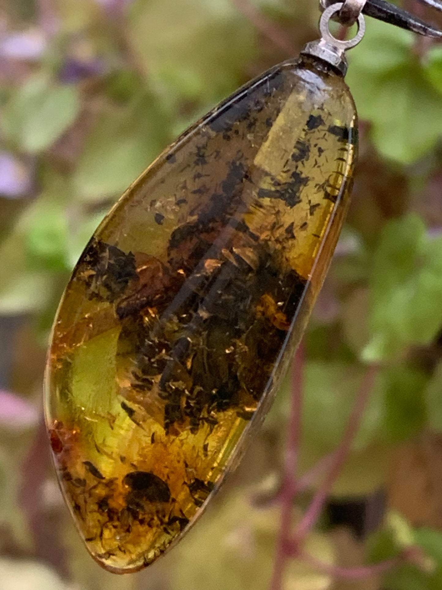 Amber, pendant measuring 40x13x9 millimeters, sold with a sliding (adjustable) black leather cord from 40 to 70 centimeters!
