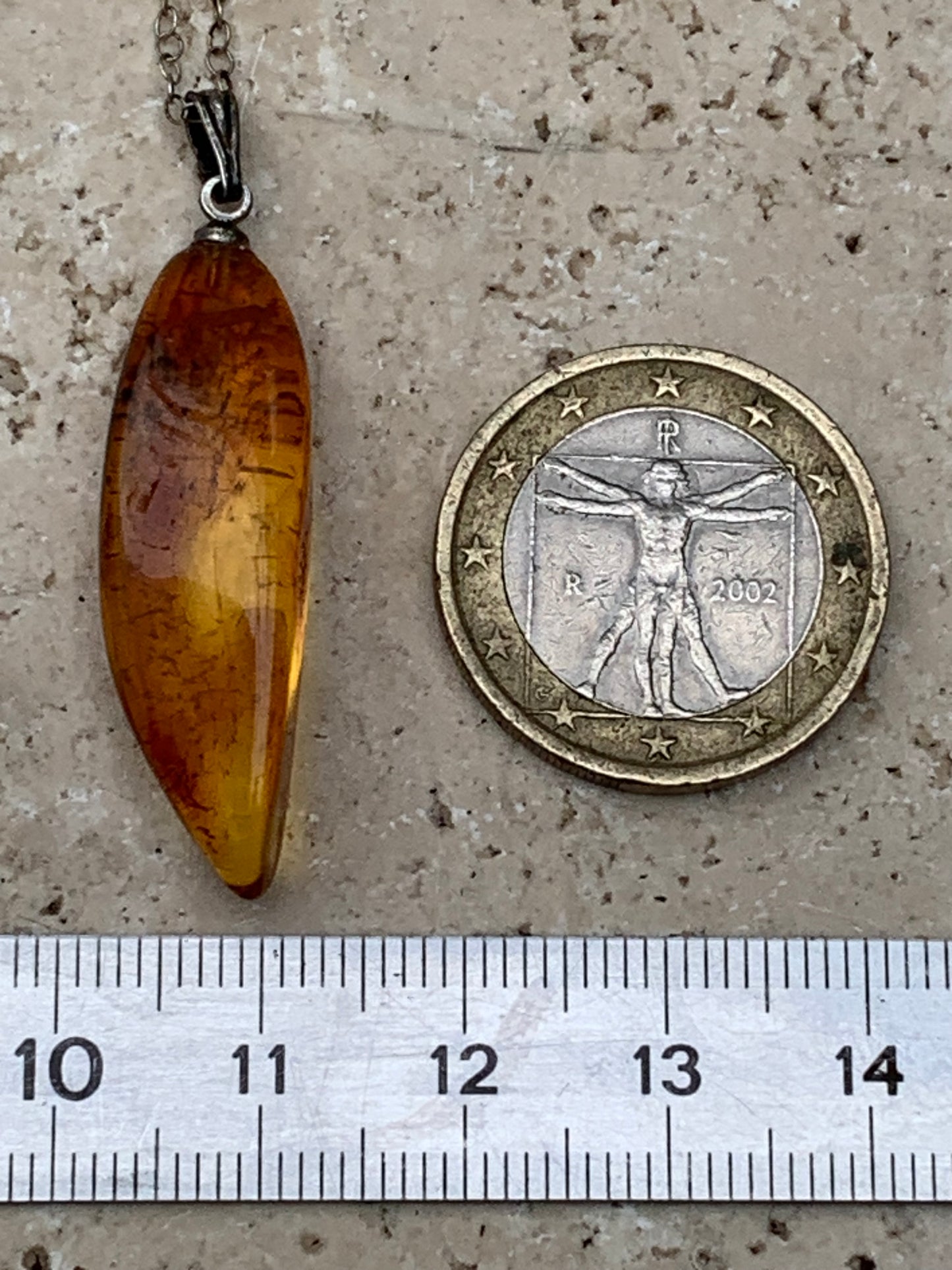 Amber, pendant measuring 40x13x9 millimeters, sold with a sliding (adjustable) black leather cord from 40 to 70 centimeters!
