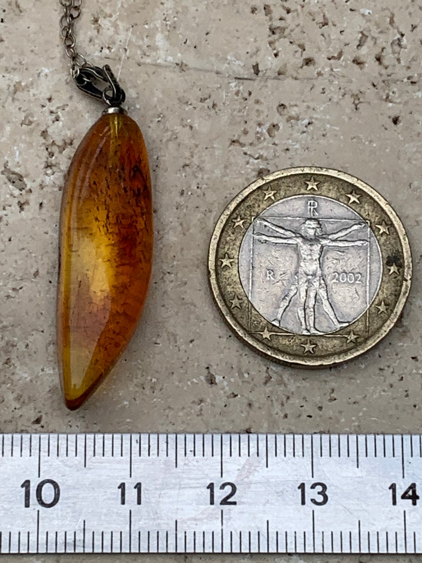 Amber, pendant measuring 40x13x9 millimeters, sold with a sliding (adjustable) black leather cord from 40 to 70 centimeters!