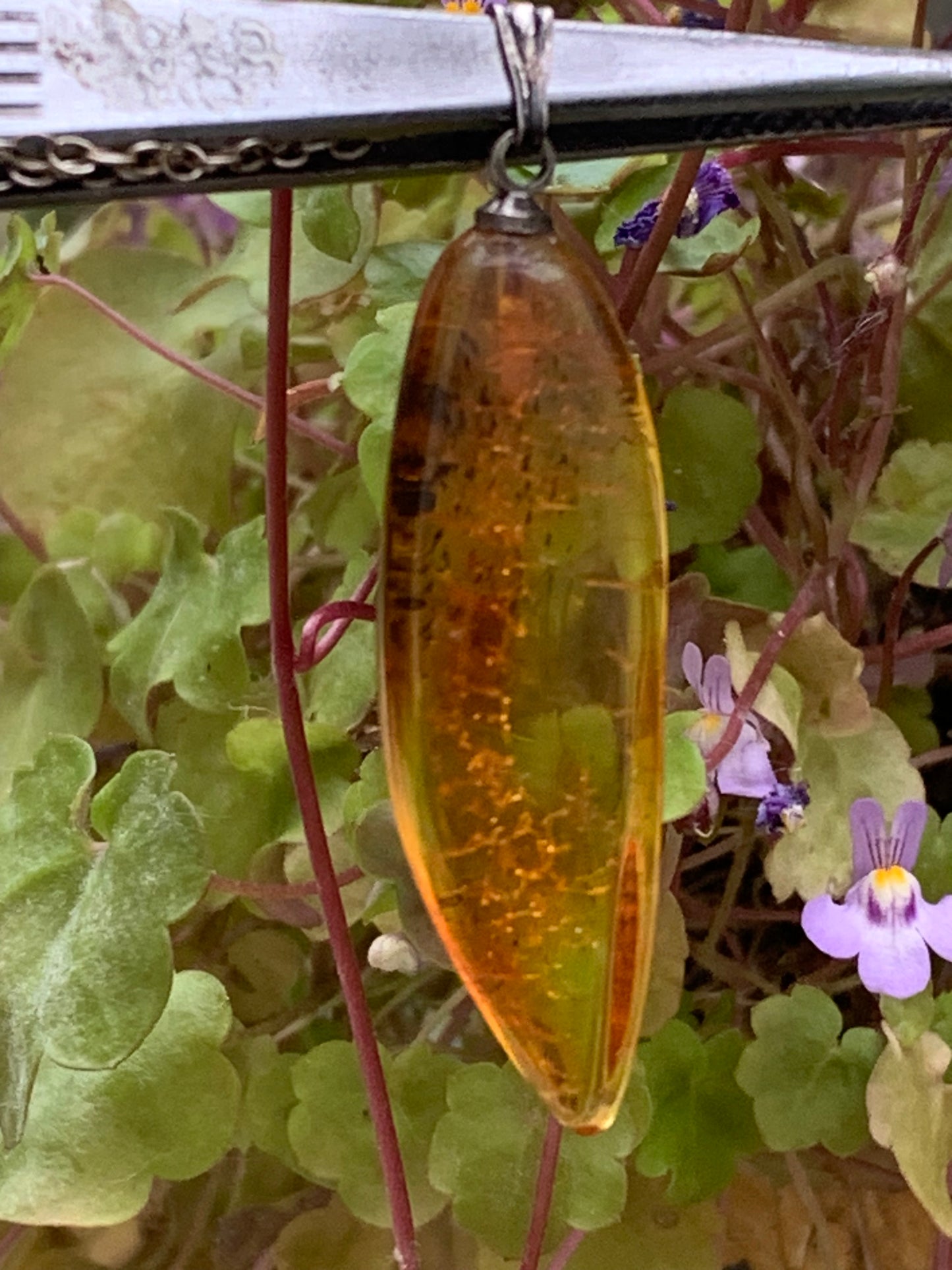 Amber, pendant measuring 40x13x9 millimeters, sold with a sliding (adjustable) black leather cord from 40 to 70 centimeters!