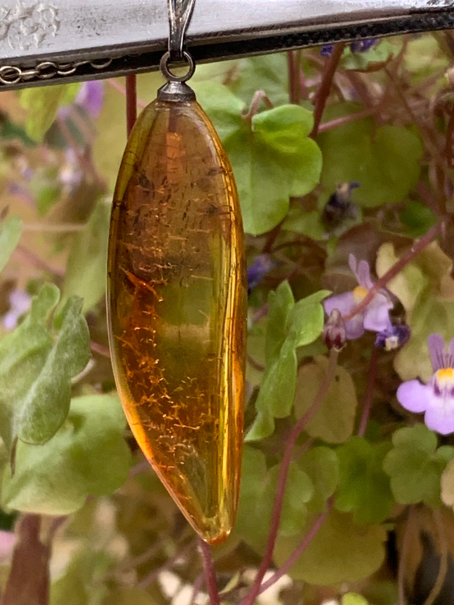 Amber, pendant measuring 40x13x9 millimeters, sold with a sliding (adjustable) black leather cord from 40 to 70 centimeters!