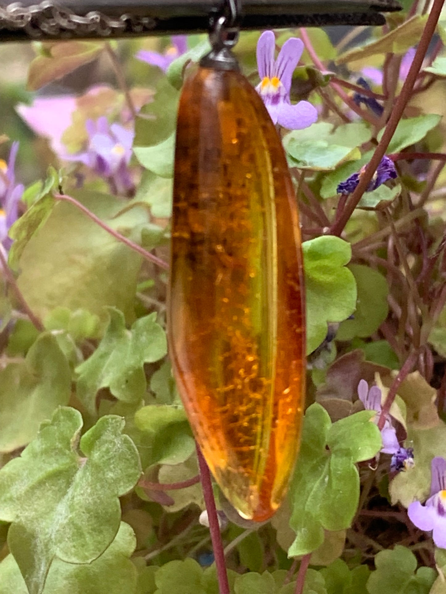 Amber, pendant measuring 40x13x9 millimeters, sold with a sliding (adjustable) black leather cord from 40 to 70 centimeters!