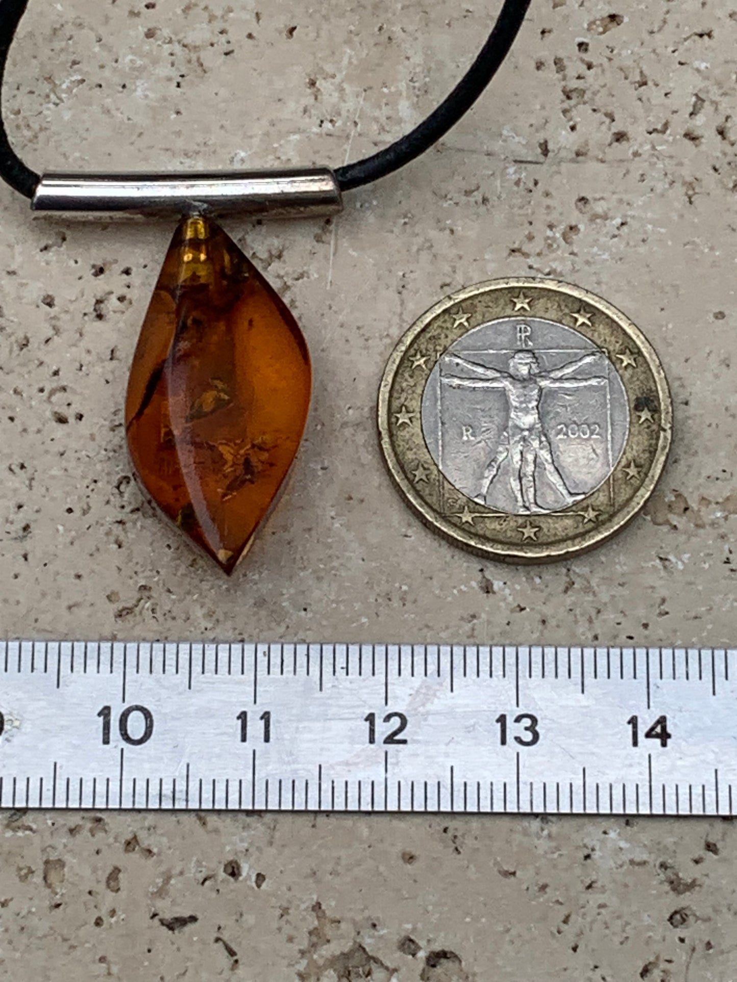 Amber, silver pendant, 35x15x10 millimeters, sold with a 42 centimeter black leather cord!