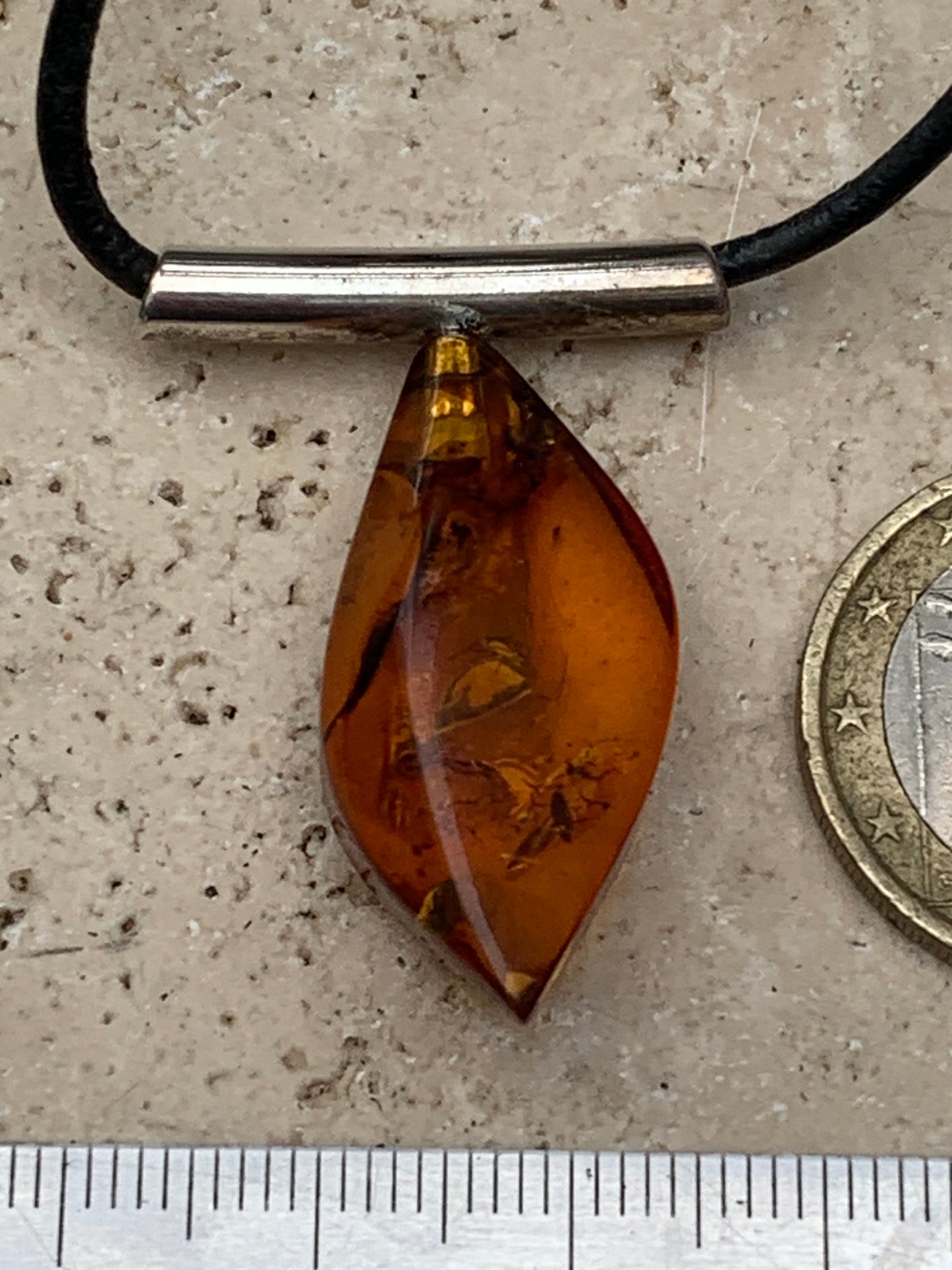 Amber, silver pendant, 35x15x10 millimeters, sold with a 42 centimeter black leather cord!
