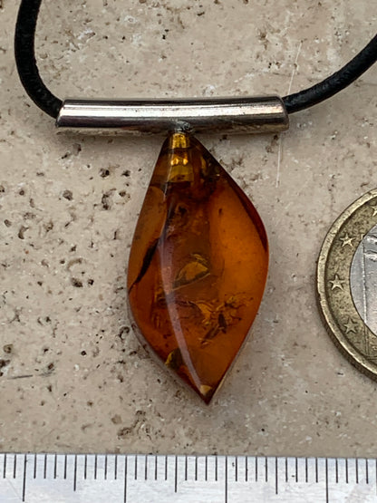 Amber, silver pendant, 35x15x10 millimeters, sold with a 42 centimeter black leather cord!