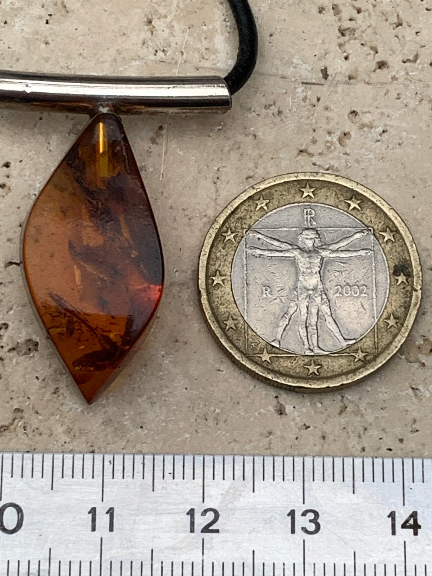 Amber, silver pendant, 35x15x10 millimeters, sold with a 42 centimeter black leather cord!