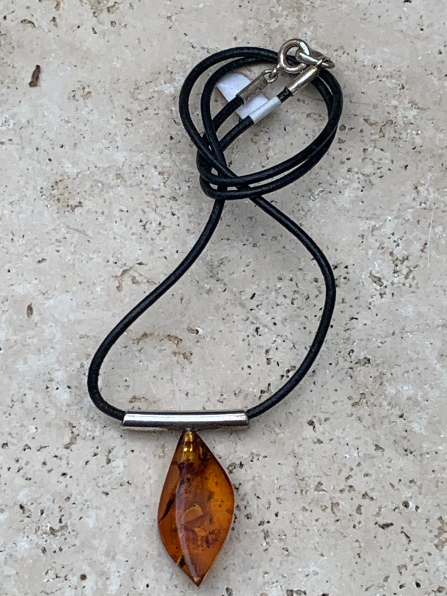 Amber, silver pendant, 35x15x10 millimeters, sold with a 42 centimeter black leather cord!