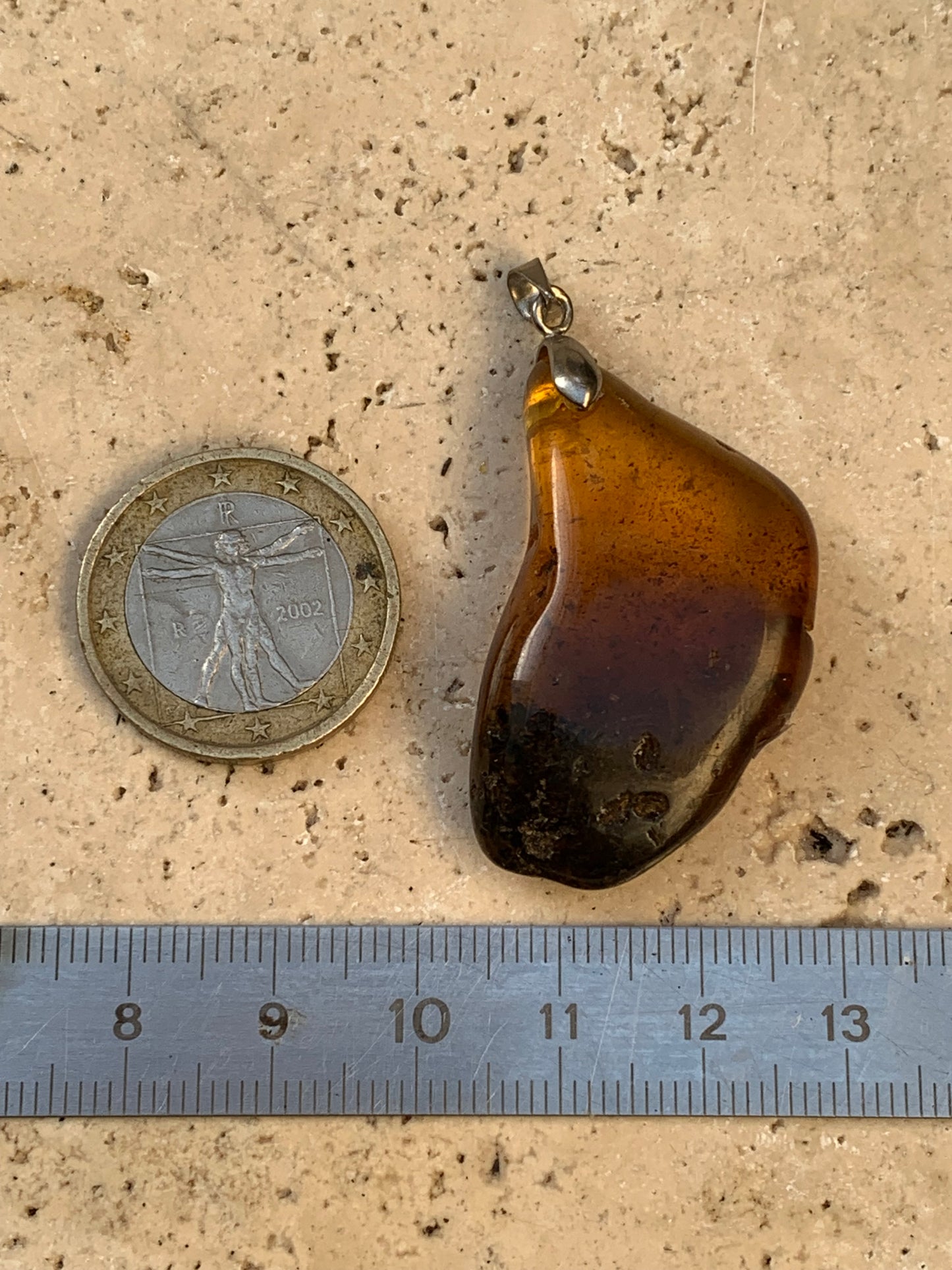 Amber, pendant, polished natural pebble measuring 47x22x10 millimeters, sold with a sliding (adjustable) black leather cord measuring 40 to 70 centimeters!