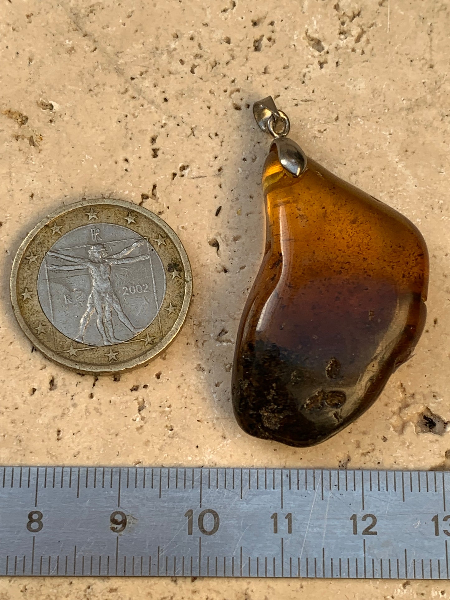 Amber, pendant, polished natural pebble measuring 47x22x10 millimeters, sold with a sliding (adjustable) black leather cord measuring 40 to 70 centimeters!