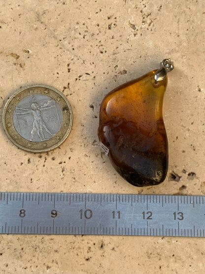 Amber, pendant, polished natural pebble measuring 47x22x10 millimeters, sold with a sliding (adjustable) black leather cord measuring 40 to 70 centimeters!
