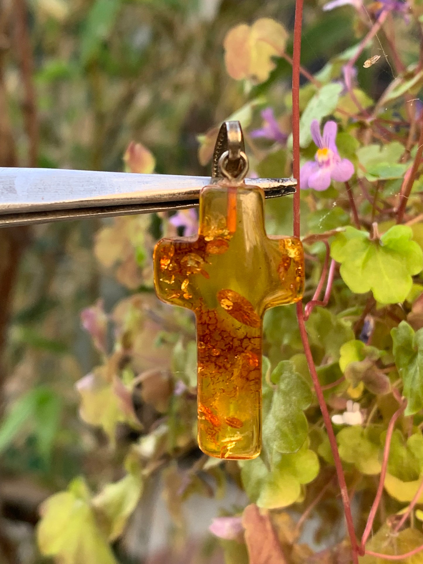 Amber, 'cross' shaped pendant measuring 40 x 18 x 7 millimeters, sold with a sliding (adjustable) black leather cord measuring 40 to 70 centimeters!