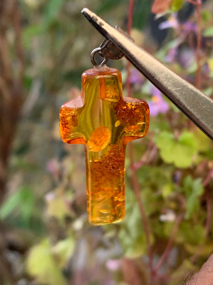 Amber, 'cross' shaped pendant measuring 40 x 18 x 7 millimeters, sold with a sliding (adjustable) black leather cord measuring 40 to 70 centimeters!