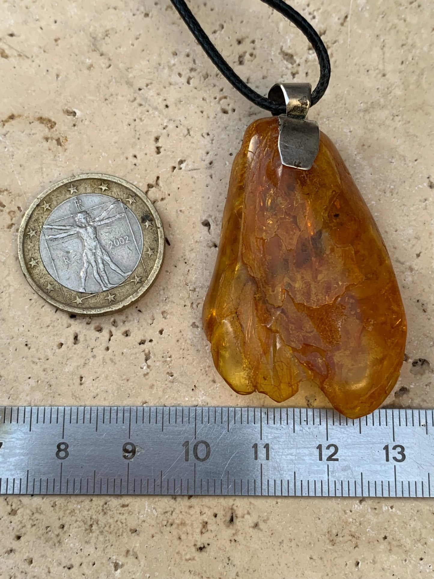 Amber, silver pendant, polished natural pebble measuring 52x30x10 millimeters, sold with a sliding (adjustable) black leather cord measuring 40 to 70 centimeters!