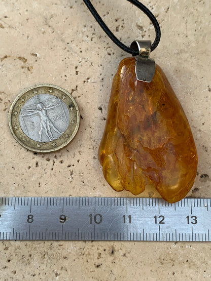 Amber, silver pendant, polished natural pebble measuring 52x30x10 millimeters, sold with a sliding (adjustable) black leather cord measuring 40 to 70 centimeters!