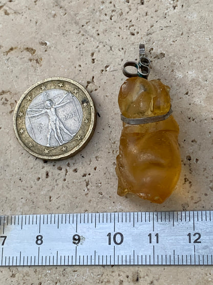 Amber, silver pendant measuring 45x15x15 millimeters, sold with a sliding (adjustable) black leather cord measuring 40 to 70 centimeters!