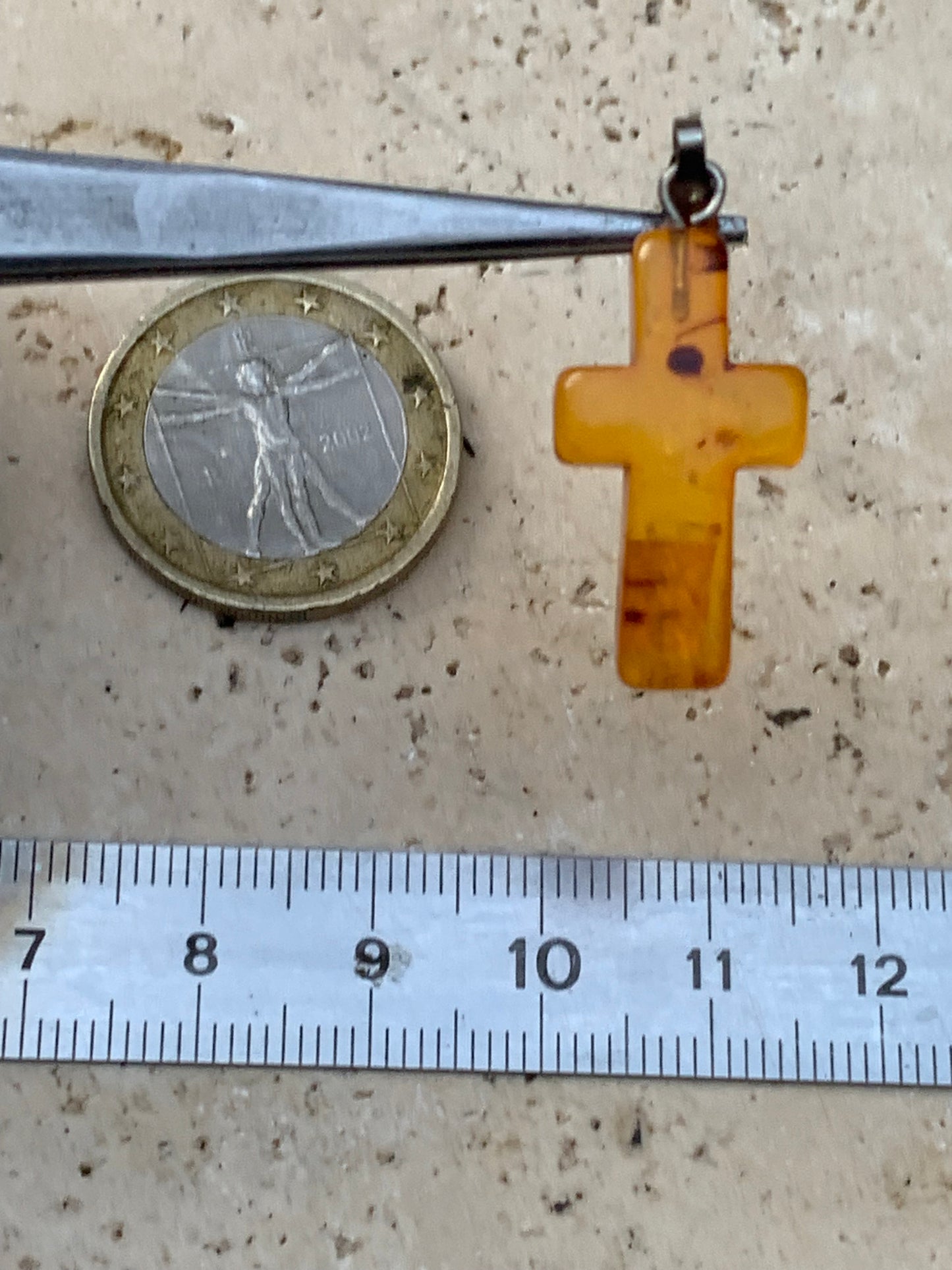 Amber, 'cross' shaped pendant measuring 34x14x5 millimeters, sold with a sliding (adjustable) black leather cord measuring 40 to 70 centimeters!