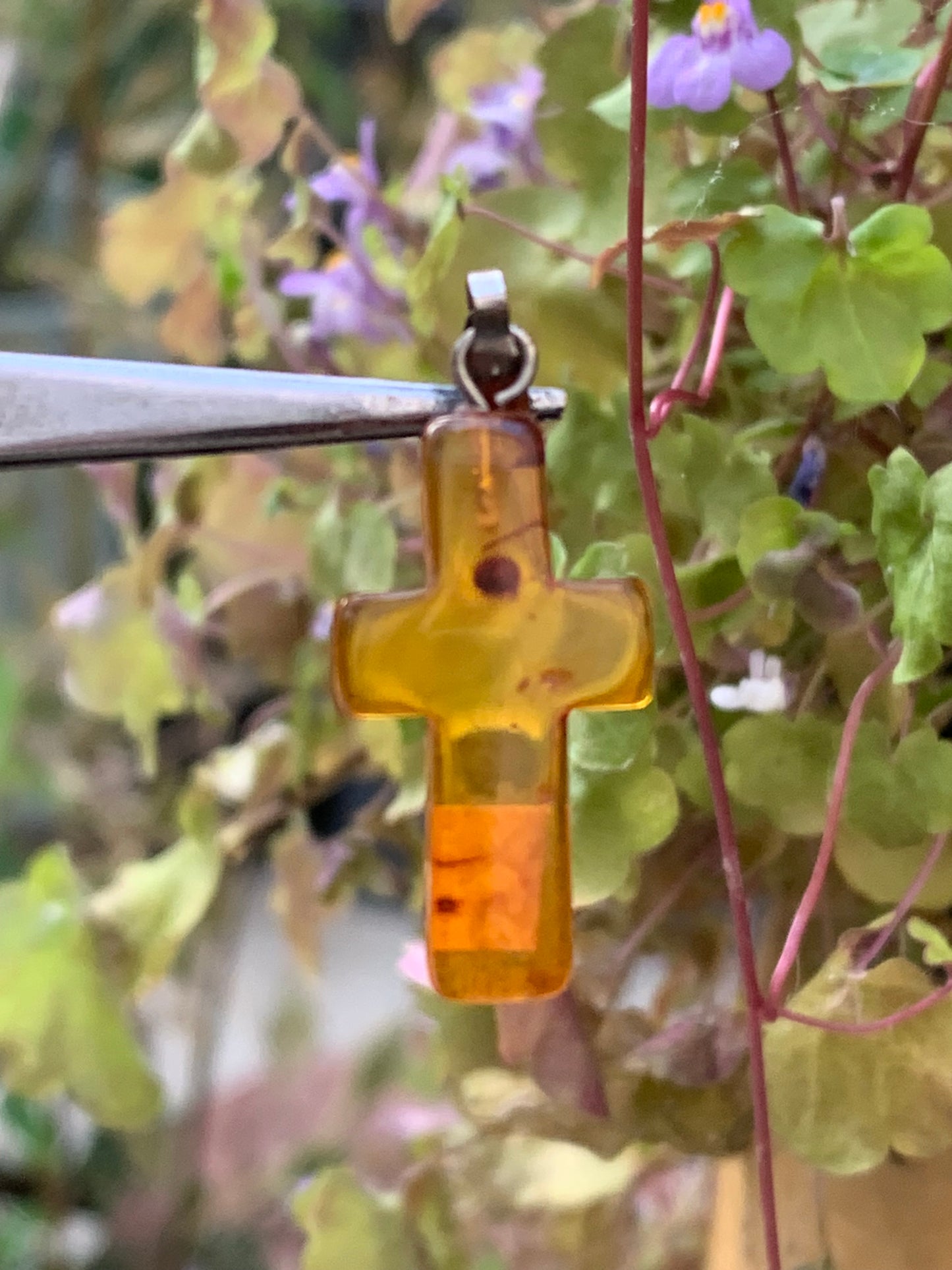 Amber, 'cross' shaped pendant measuring 34x14x5 millimeters, sold with a sliding (adjustable) black leather cord measuring 40 to 70 centimeters!