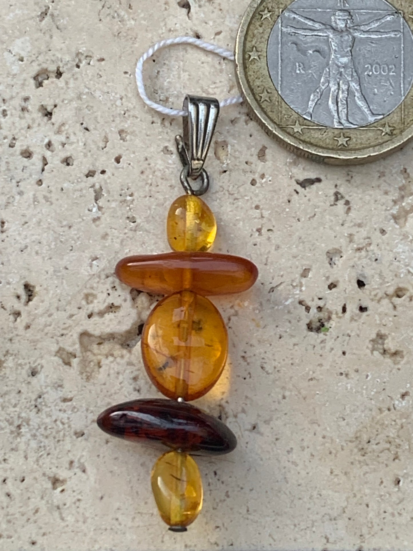 Amber, pendant made by G &amp; Z of 45x15x9 millimeters, sold with sliding cord (adjustable), in black leather from 40 to 70 centimeters!
