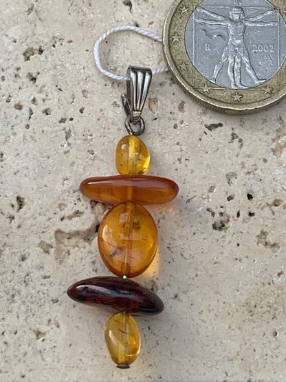 Amber, pendant made by G &amp; Z of 45x15x9 millimeters, sold with sliding cord (adjustable), in black leather from 40 to 70 centimeters!
