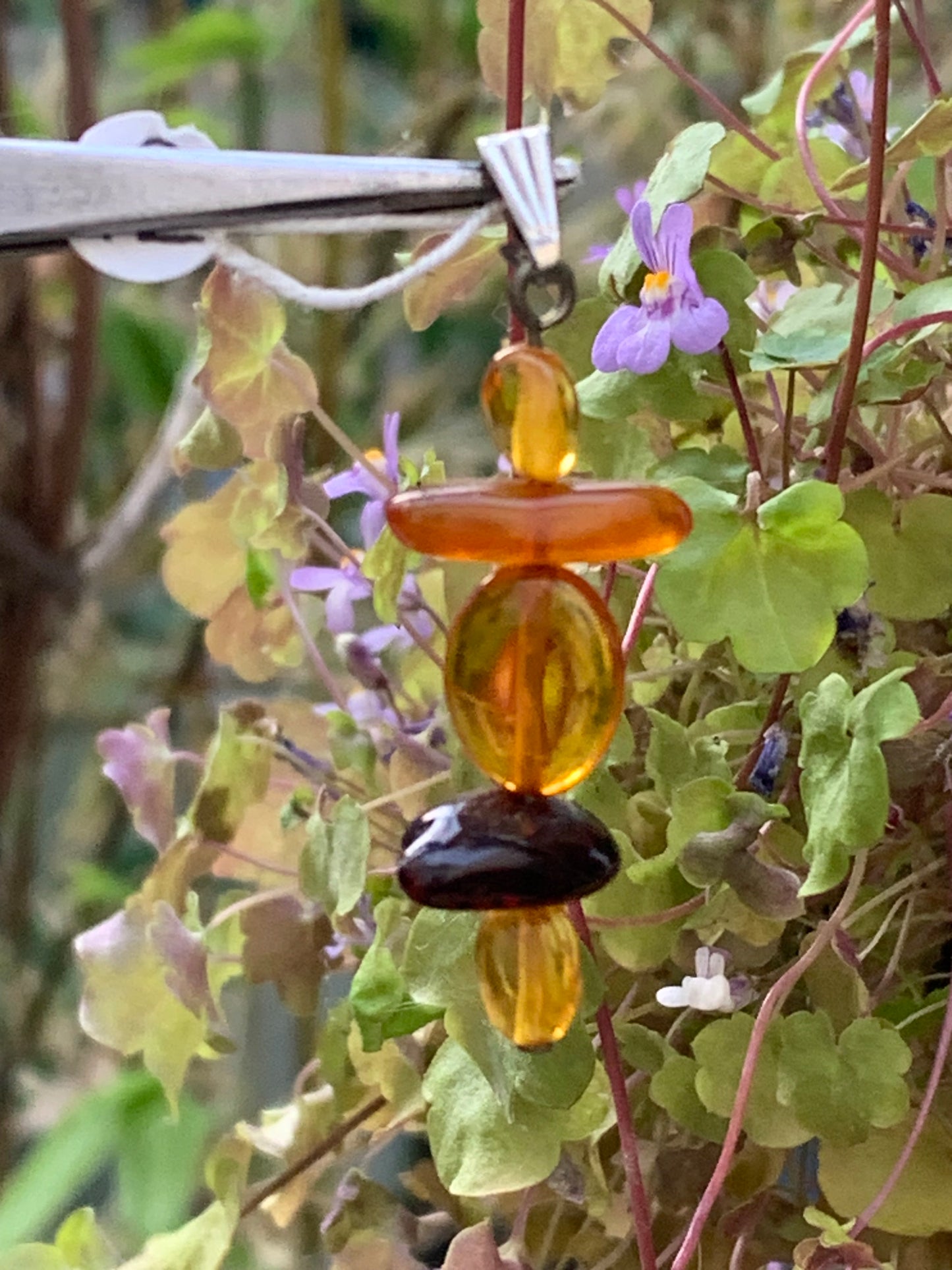 Amber, pendant made by G &amp; Z of 45x15x9 millimeters, sold with sliding cord (adjustable), in black leather from 40 to 70 centimeters!