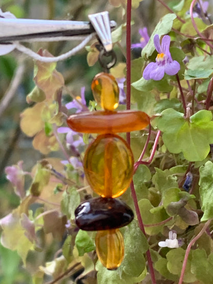 Amber, pendant made by G &amp; Z of 45x15x9 millimeters, sold with sliding cord (adjustable), in black leather from 40 to 70 centimeters!