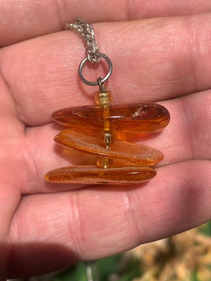 Amber, pendant of 3 polished natural pebbles measuring 32x30x15 millimeters, sold with a sliding cord (adjustable), in black leather from 40 to 70 centimeters!