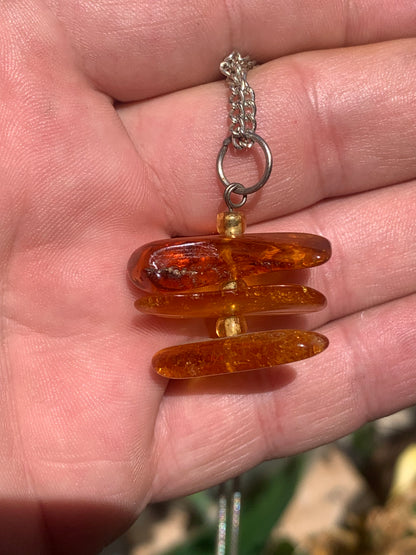 Amber, pendant of 3 polished natural pebbles measuring 32x30x15 millimeters, sold with a sliding cord (adjustable), in black leather from 40 to 70 centimeters!
