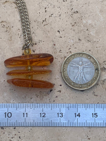 Amber, pendant of 3 polished natural pebbles measuring 32x30x15 millimeters, sold with a sliding cord (adjustable), in black leather from 40 to 70 centimeters!