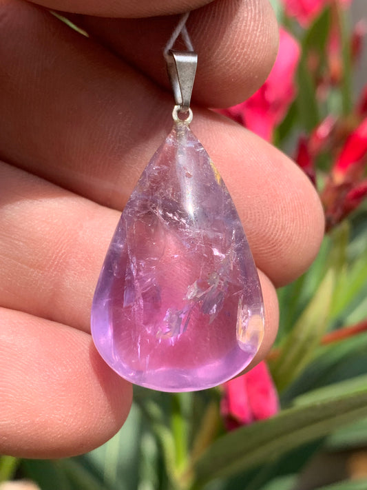 Amethyst, 'drop' pendant, 40mm high x 20mm wide x 10mm thick. Sold with a free adjustable black cord!