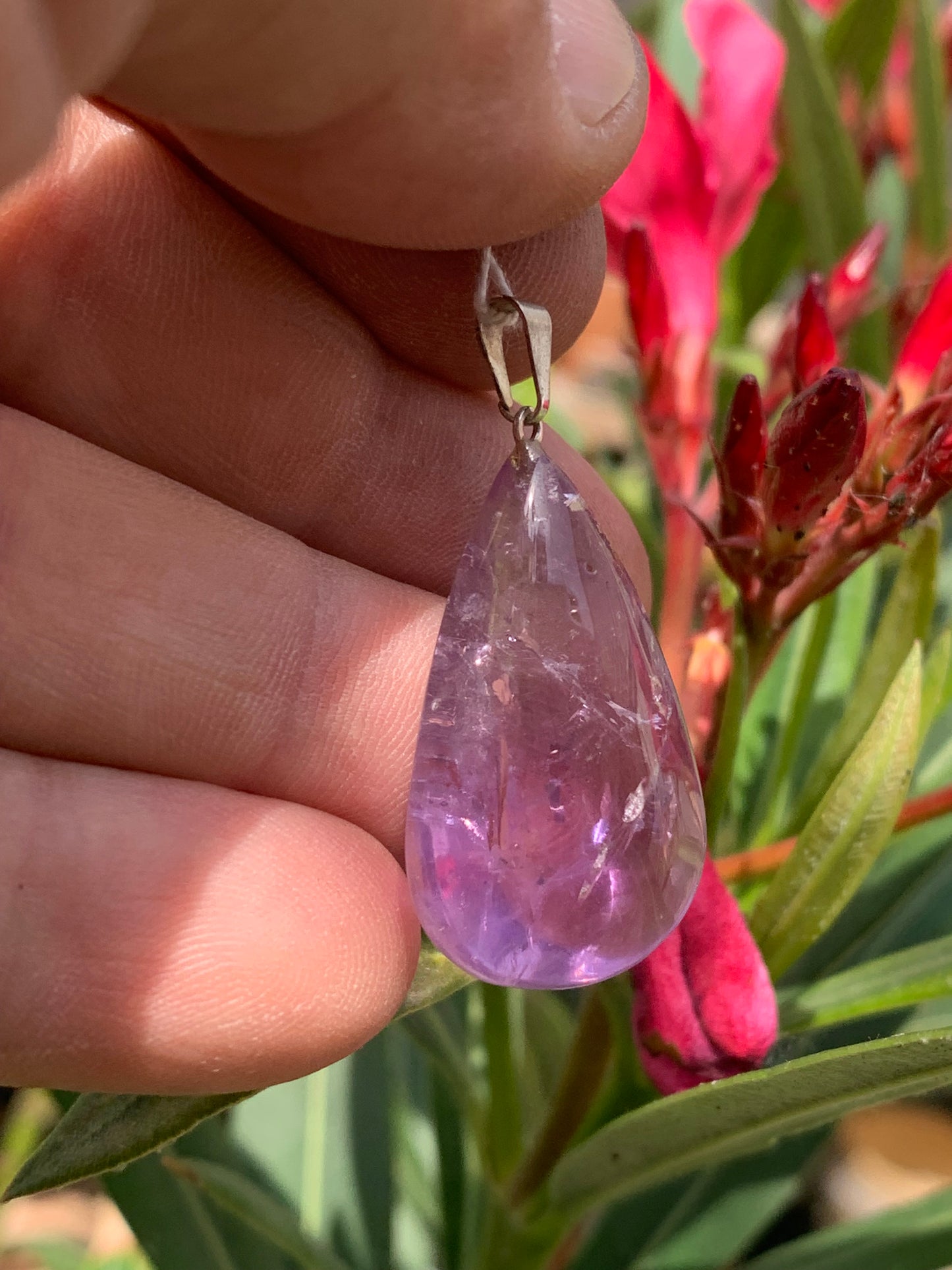 Amethyst, 'drop' pendant, 40mm high x 20mm wide x 10mm thick. Sold with a free adjustable black cord!