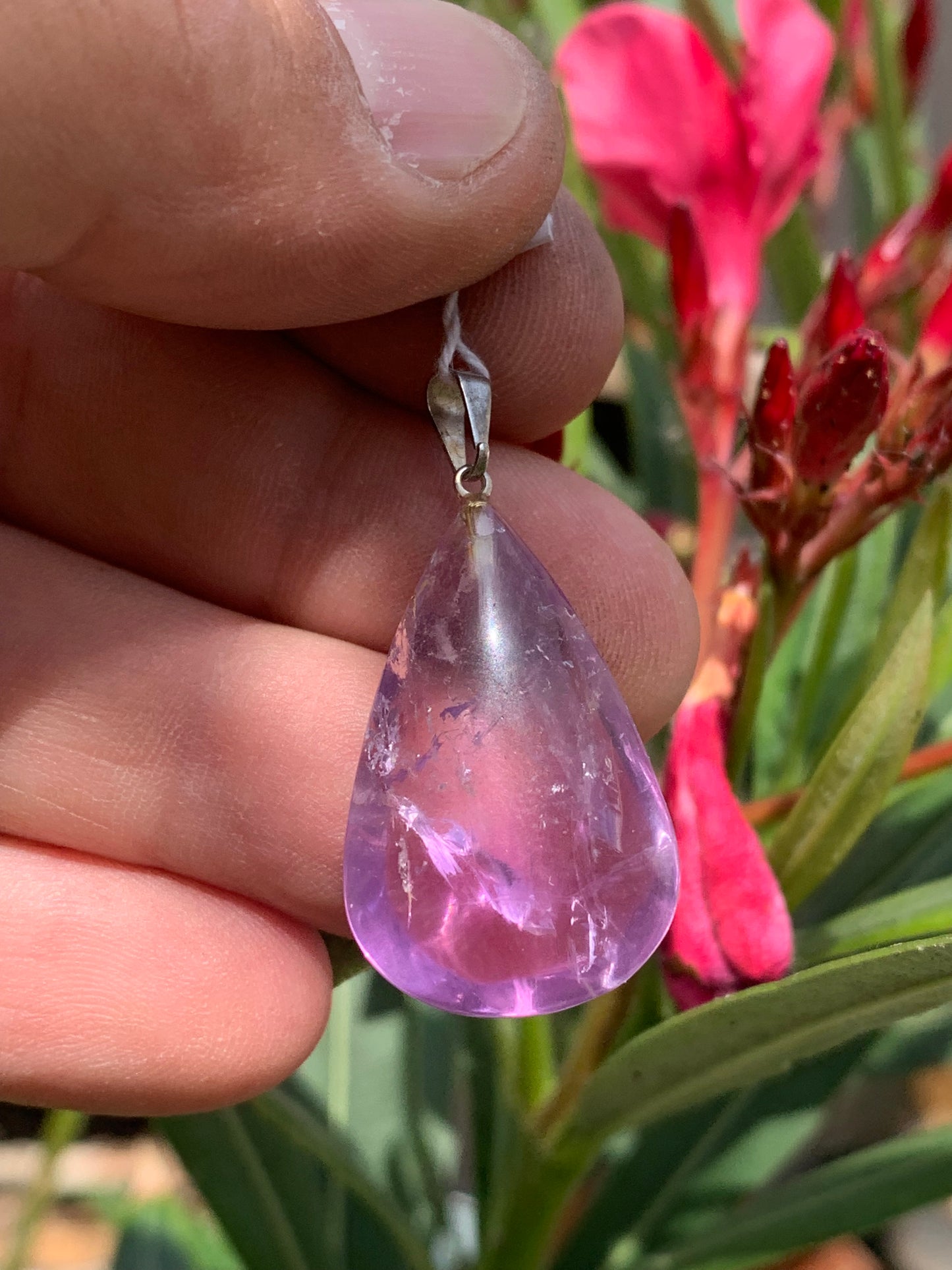 Amethyst, 'drop' pendant, 40mm high x 20mm wide x 10mm thick. Sold with a free adjustable black cord!