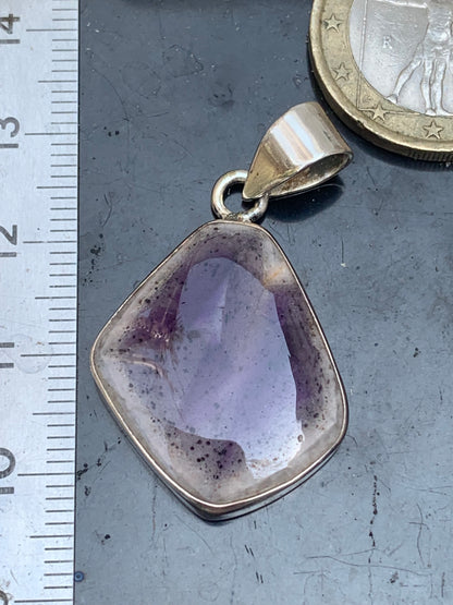 Amethyst 'super 7/ super seven', Silver pendant 37mm high x 22mm wide x 6mm thick. Sold with a free adjustable black cord!