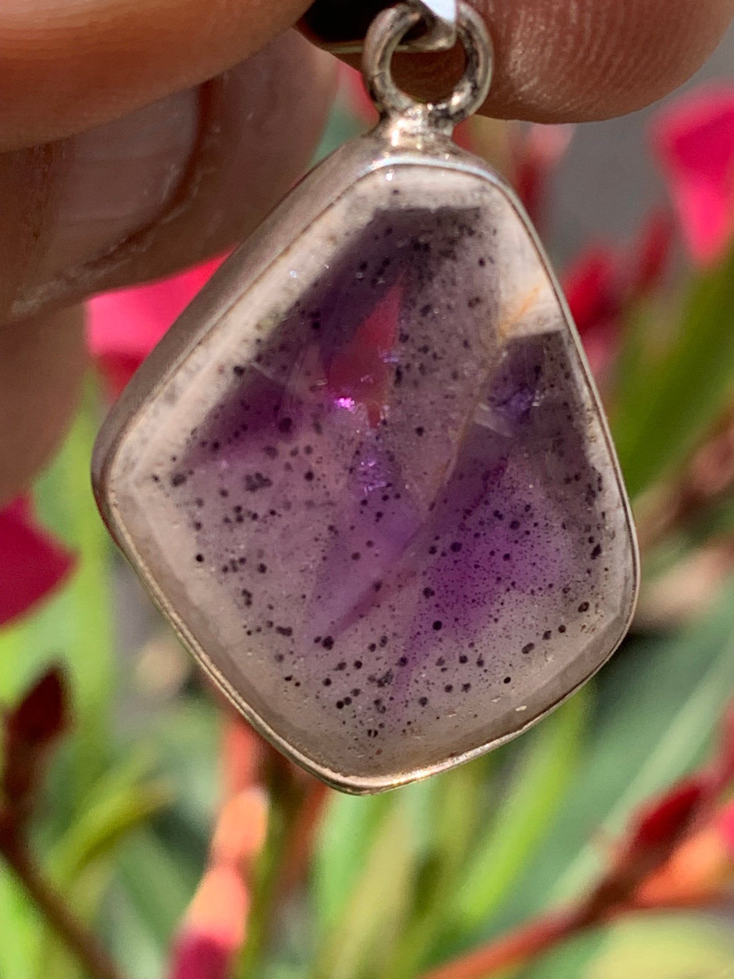 Amethyst 'super 7/ super seven', Silver pendant 37mm high x 22mm wide x 6mm thick. Sold with a free adjustable black cord!