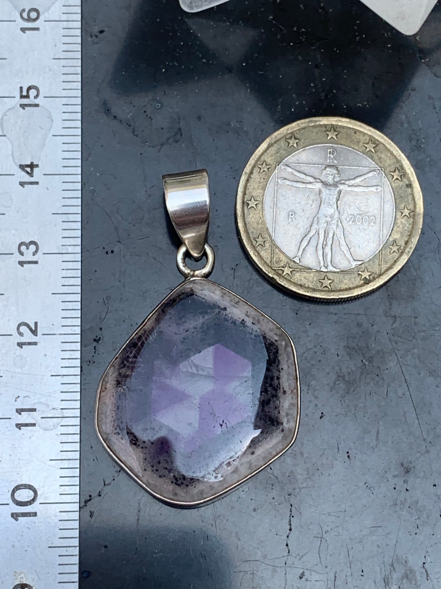 Amethyst 'super 7/ super seven', Silver pendant, 40mm high x 25mm wide x 6mm thick. Sold with a free adjustable black cord!