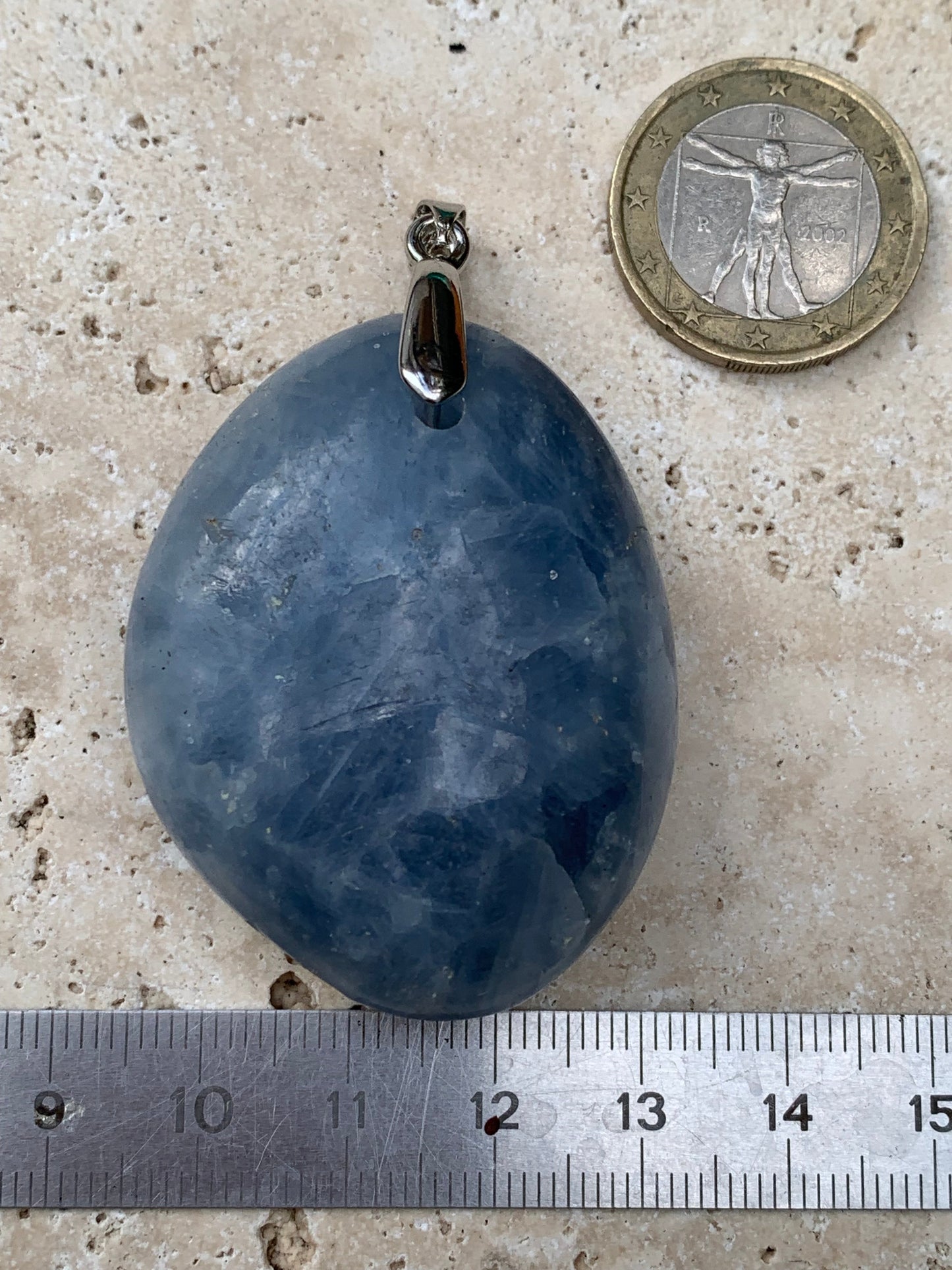 Blue calcite, pendant measuring 47mm high x 37mm wide x 18mm deep. Sold with an adjustable black cord!
