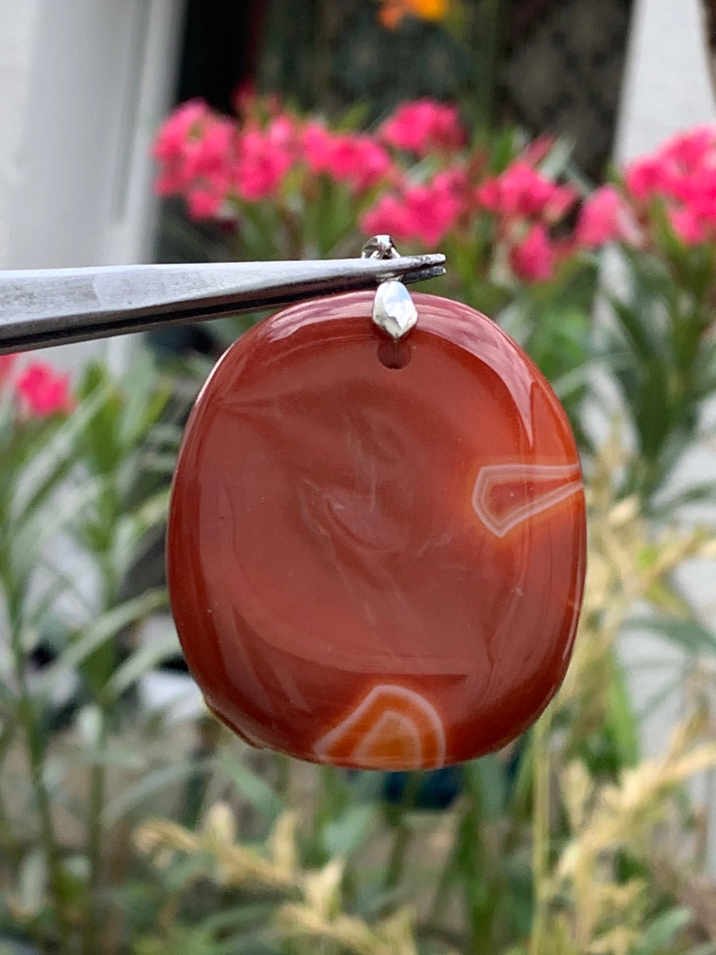 Carnelian, pendant measuring 55mm high x 38mm wide x 9mm thick. Sold with an adjustable black cord!