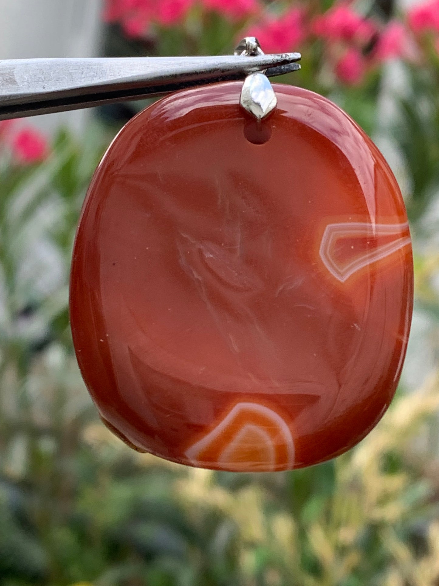 Carnelian, pendant measuring 55mm high x 38mm wide x 9mm thick. Sold with an adjustable black cord!