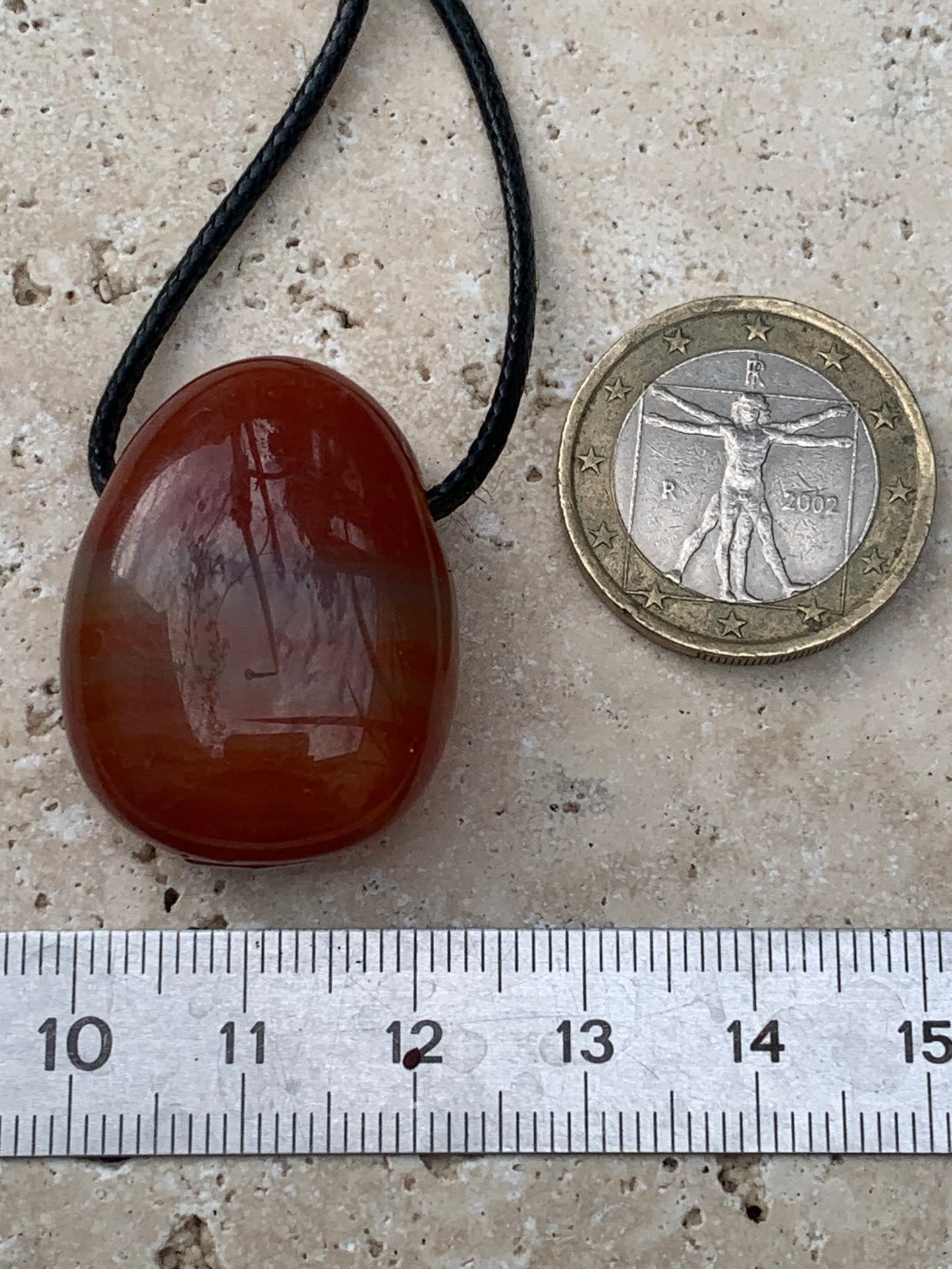 Carnelian, pendant measuring 31mm high x 23mm wide x 12mm thick. Sold with an adjustable black cord!