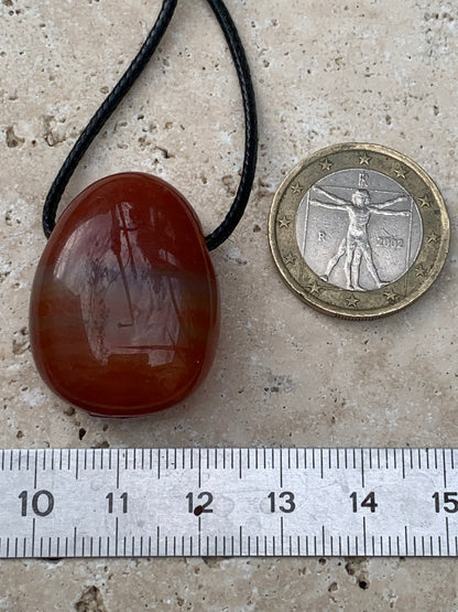 Carnelian, pendant measuring 31mm high x 23mm wide x 12mm thick. Sold with an adjustable black cord!