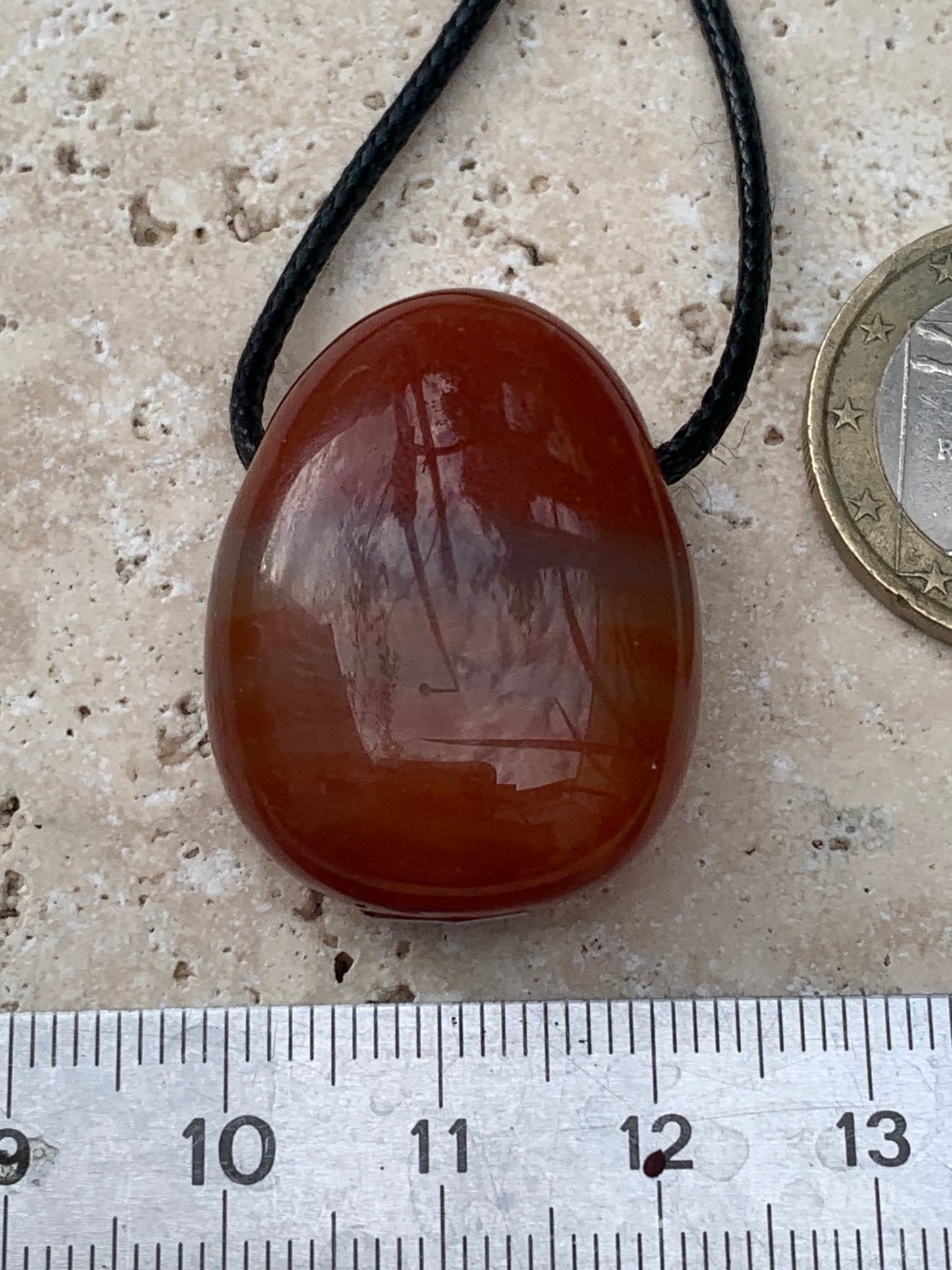 Carnelian, pendant measuring 31mm high x 23mm wide x 12mm thick. Sold with an adjustable black cord!