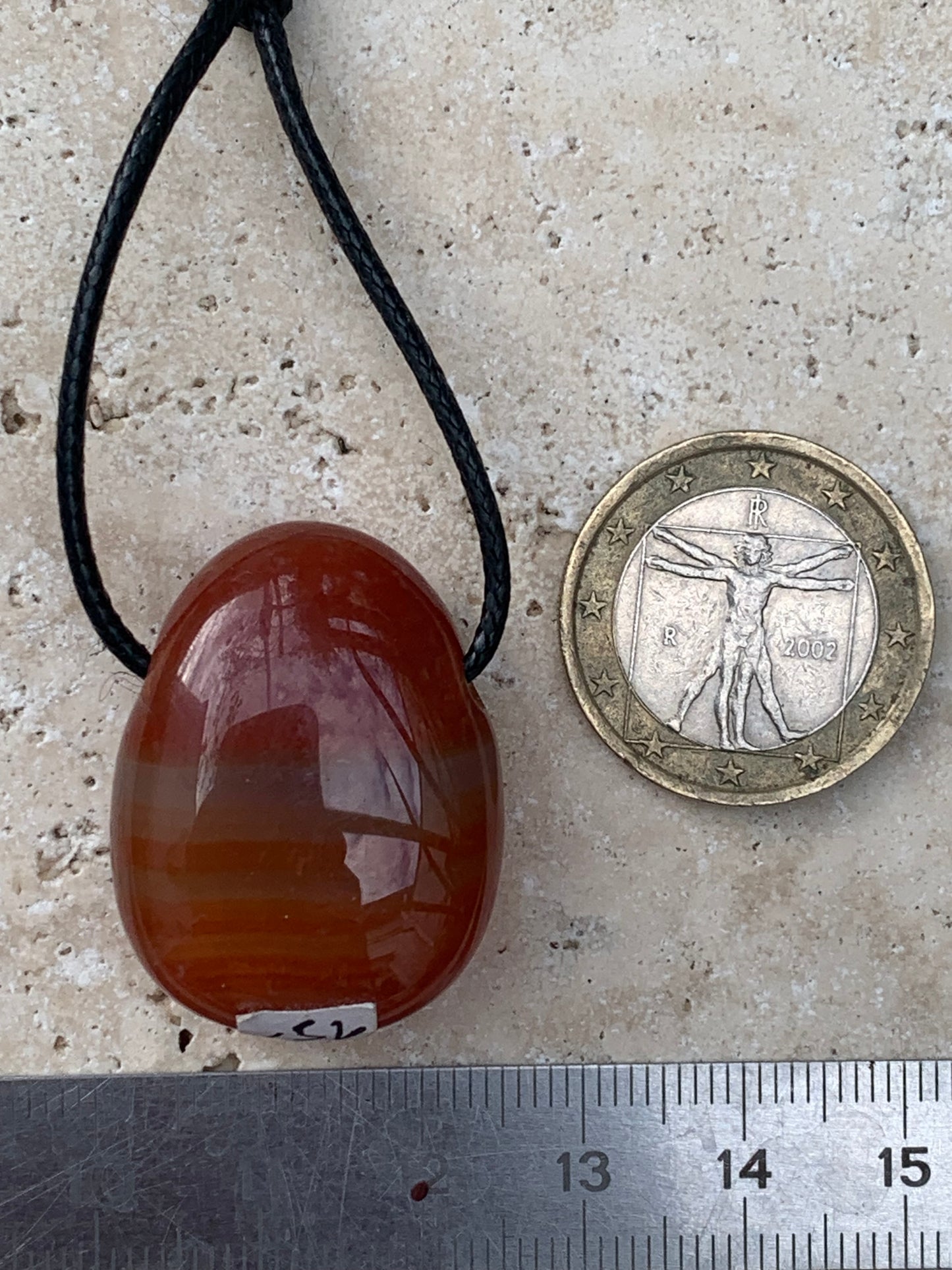 Carnelian, pendant measuring 31mm high x 23mm wide x 12mm thick. Sold with an adjustable black cord!