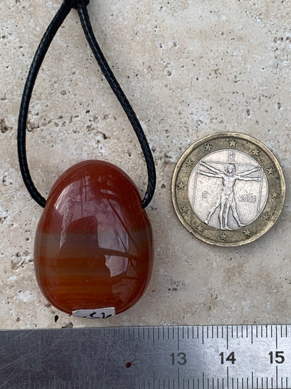 Carnelian, pendant measuring 31mm high x 23mm wide x 12mm thick. Sold with an adjustable black cord!