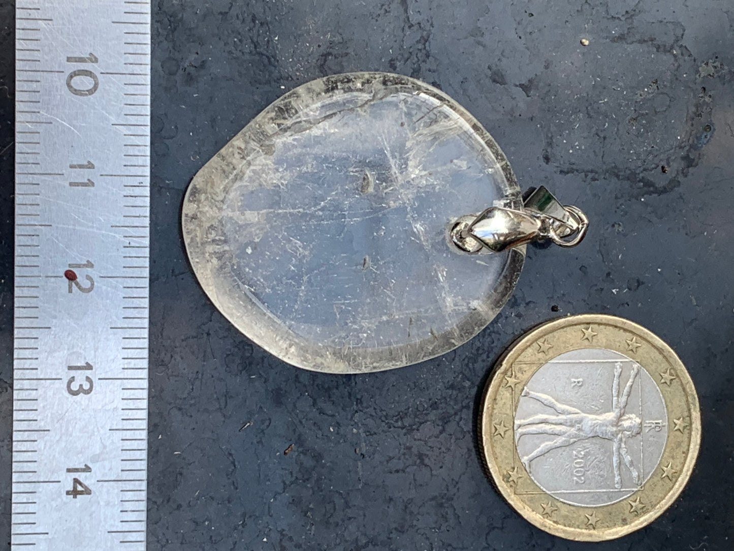 Rock crystal/Quartz, pendant measuring 45mm high x 30mm wide x 7mm thick. Sold with an adjustable black cord!