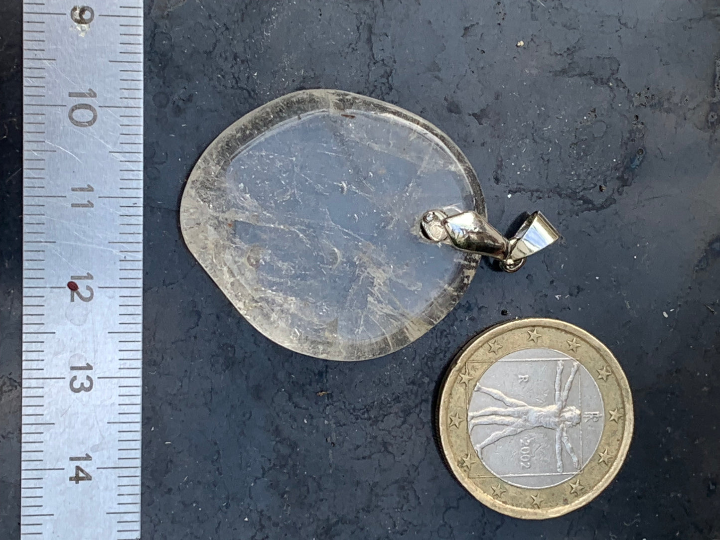 Rock crystal/Quartz, pendant measuring 45mm high x 30mm wide x 7mm thick. Sold with an adjustable black cord!