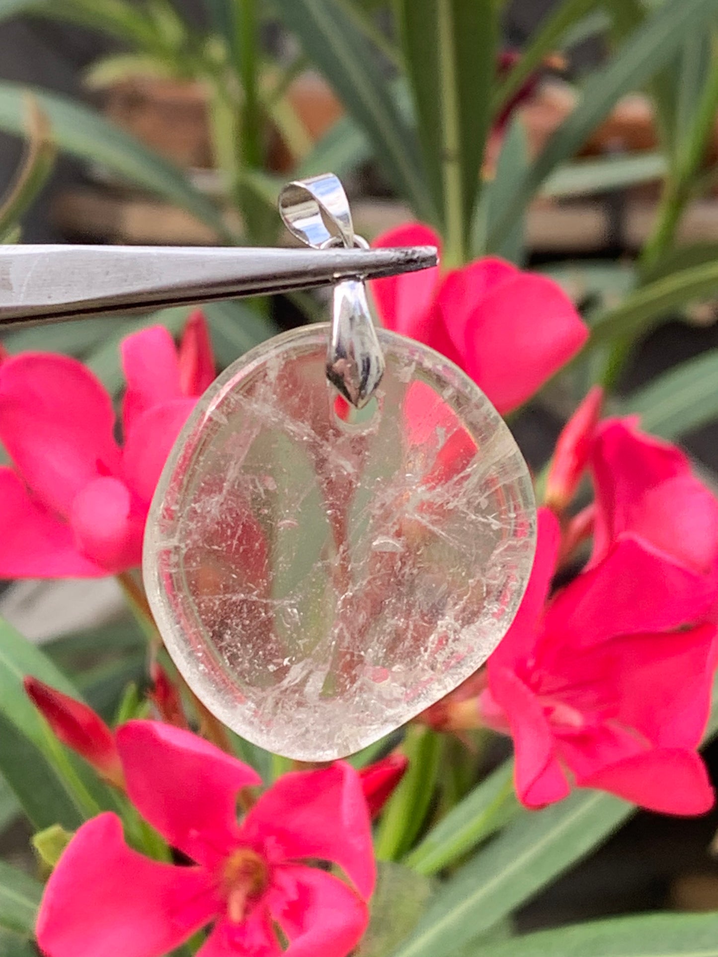 Rock crystal/Quartz, pendant measuring 45mm high x 30mm wide x 7mm thick. Sold with an adjustable black cord!