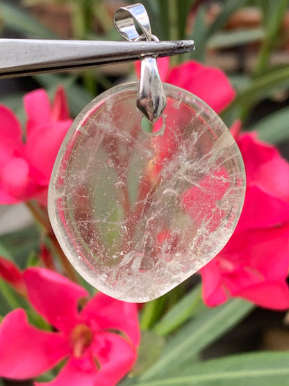 Rock crystal/Quartz, pendant measuring 45mm high x 30mm wide x 7mm thick. Sold with an adjustable black cord!