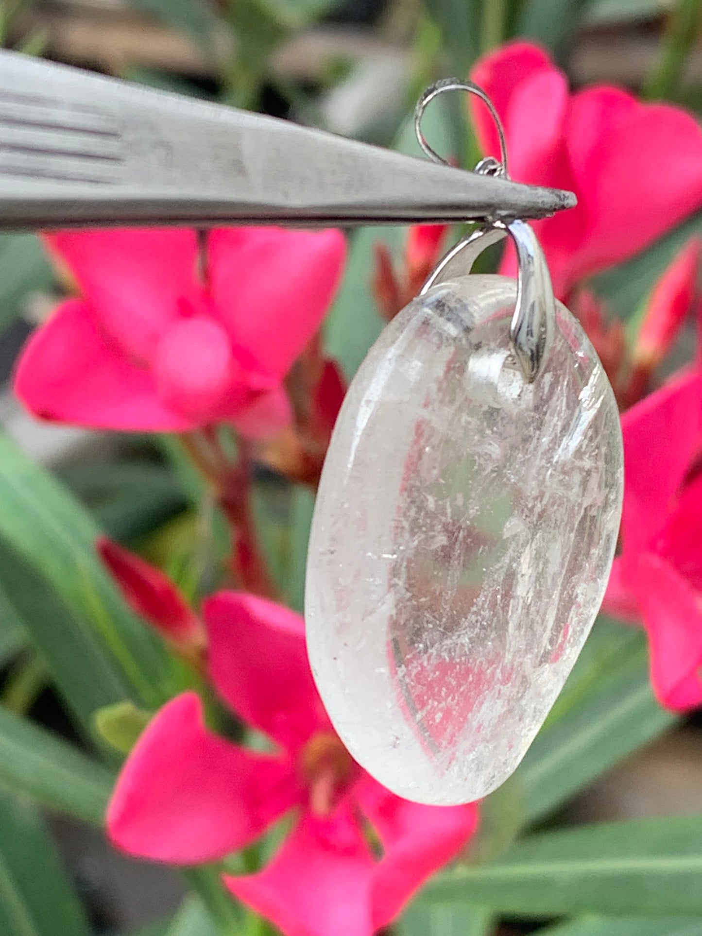 Rock crystal/Quartz, pendant measuring 45mm high x 30mm wide x 7mm thick. Sold with an adjustable black cord!