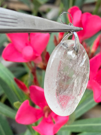 Rock crystal/Quartz, pendant measuring 45mm high x 30mm wide x 7mm thick. Sold with an adjustable black cord!