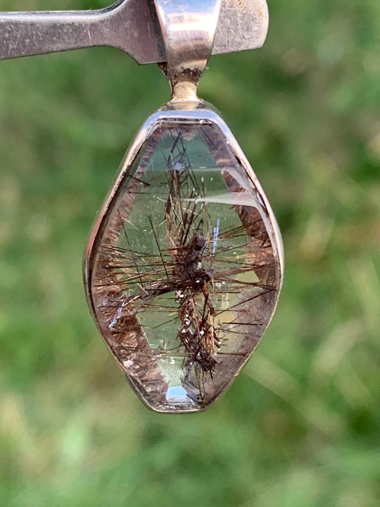 Rock crystal (quartz), with tourmaline inclusions! Silver pendant, 38 mm high x 16 x 8 - 8.3 grams. Sold with an adjustable black cord!
