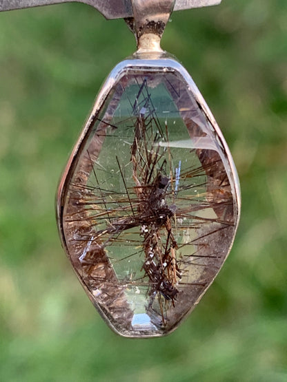 Rock crystal (quartz), with tourmaline inclusions! Silver pendant, 38 mm high x 16 x 8 - 8.3 grams. Sold with an adjustable black cord!